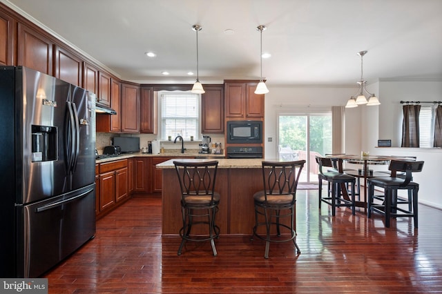 2652 Academic Ct, Waldorf, MD 20603 - kitchen with stainless steel fridge with ice dispenser, black microwave, plenty of natural light, dark wood-style flooring, and recessed lighting