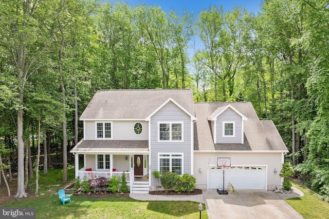 240 Charleston Rd, Ocean Pines, MD 21811 - traditional home featuring a porch, concrete driveway, a front lawn, a garage, and roof with shingles