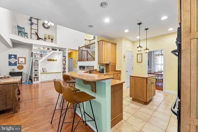 240 Charleston Rd, Ocean Pines, MD 21811 - kitchen featuring a peninsula, a center island, a kitchen breakfast bar, recessed lighting, and hanging light fixtures