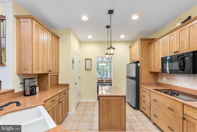 240 Charleston Rd, Ocean Pines, MD 21811 - kitchen featuring black appliances, light brown cabinets, a center island, backsplash, and light tile patterned flooring