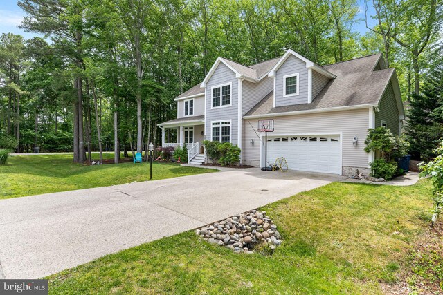 240 Charleston Rd, Ocean Pines, MD 21811 - traditional-style home featuring concrete driveway, a shingled roof, an attached garage, a front yard, and view of scattered trees