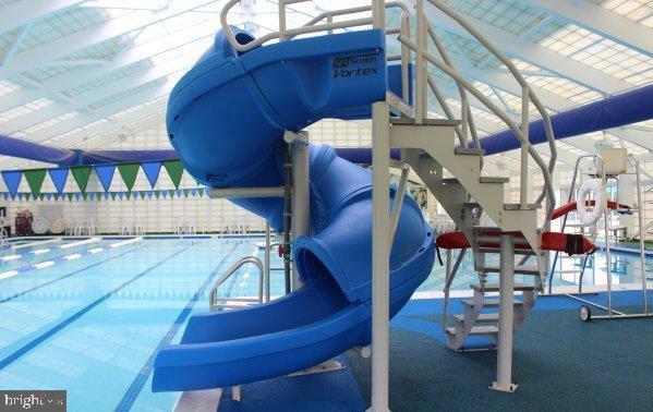 240 Charleston Rd, Ocean Pines, MD 21811 - view of jungle gym with a community pool