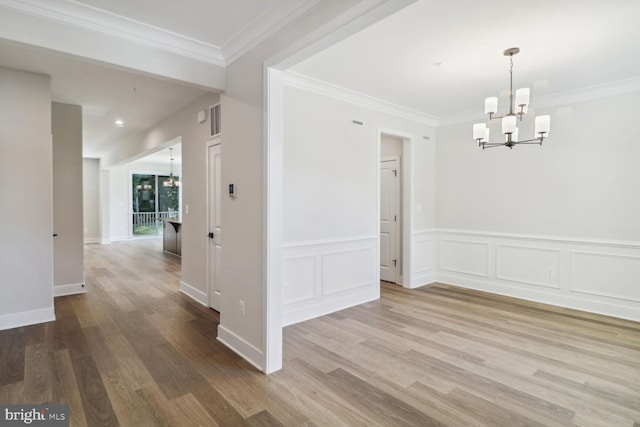 4010 Milner Rd, Nottingham, MD 21236 - unfurnished dining area featuring a chandelier, wood finished floors, wainscoting, and crown molding