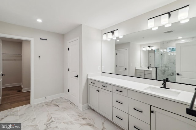 4010 Milner Rd, Nottingham, MD 21236 - full bath featuring a marble finish shower, a spacious closet, vanity, baseboards, and recessed lighting