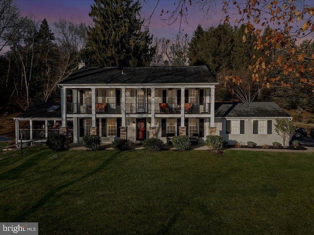 601 Crum Creek Rd, Media, PA 19063 - neoclassical / greek revival house with a balcony, a front yard, and a chimney