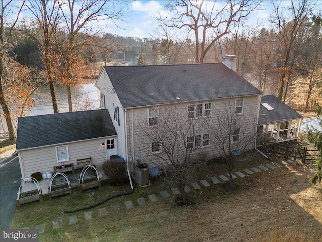 601 Crum Creek Rd, Media, PA 19063 - rear view of house with a chimney, cooling unit, and roof with shingles