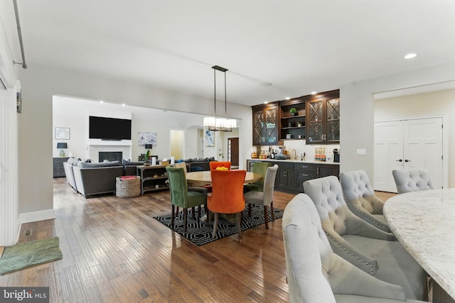 415 Pyles Mountain Ln, Avondale, PA 19311 - dining space featuring wet bar, recessed lighting, wood-type flooring, a chandelier, and a fireplace