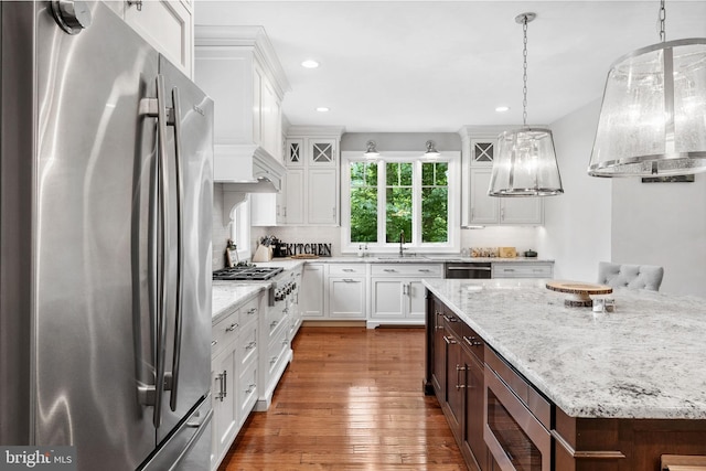 415 Pyles Mountain Ln, Avondale, PA 19311 - kitchen with stainless steel appliances, wall chimney exhaust hood, white cabinetry, dark wood-type flooring, and recessed lighting