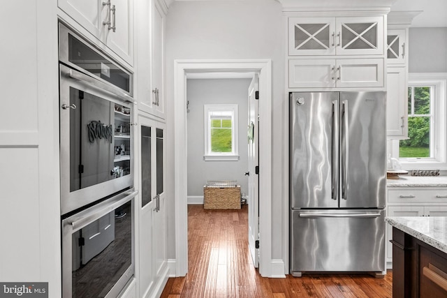415 Pyles Mountain Ln, Avondale, PA 19311 - kitchen featuring stainless steel appliances, plenty of natural light, and white cabinets