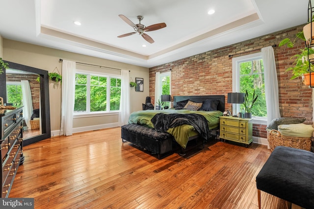 415 Pyles Mountain Ln, Avondale, PA 19311 - bedroom featuring a raised ceiling, hardwood / wood-style flooring, brick wall, a ceiling fan, and recessed lighting