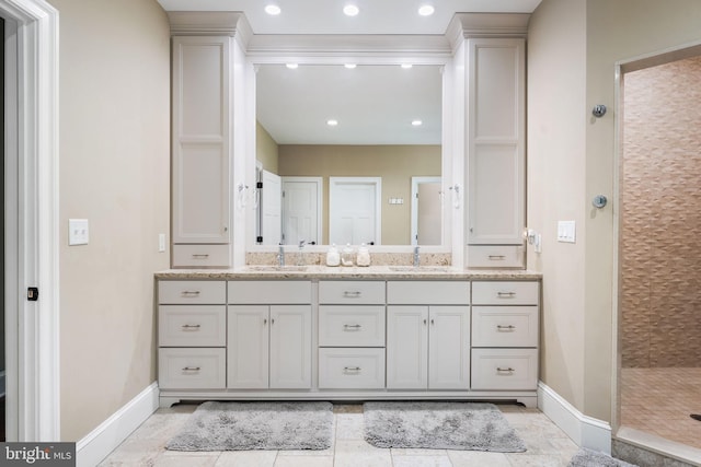 415 Pyles Mountain Ln, Avondale, PA 19311 - bathroom featuring double vanity, a tile shower, and recessed lighting