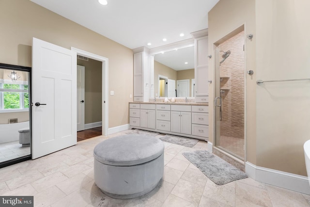 415 Pyles Mountain Ln, Avondale, PA 19311 - bathroom featuring vanity, a shower stall, a freestanding bath, and recessed lighting