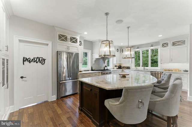 415 Pyles Mountain Ln, Avondale, PA 19311 - kitchen featuring freestanding refrigerator, a kitchen island, glass insert cabinets, dark wood-type flooring, and white cabinetry