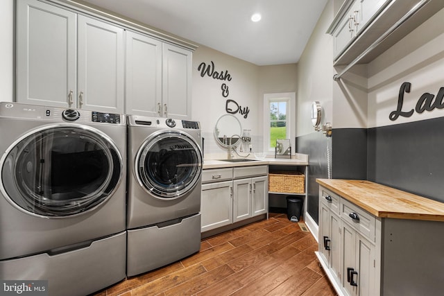 415 Pyles Mountain Ln, Avondale, PA 19311 - washroom with washing machine and clothes dryer, cabinet space, wood finished floors, and recessed lighting
