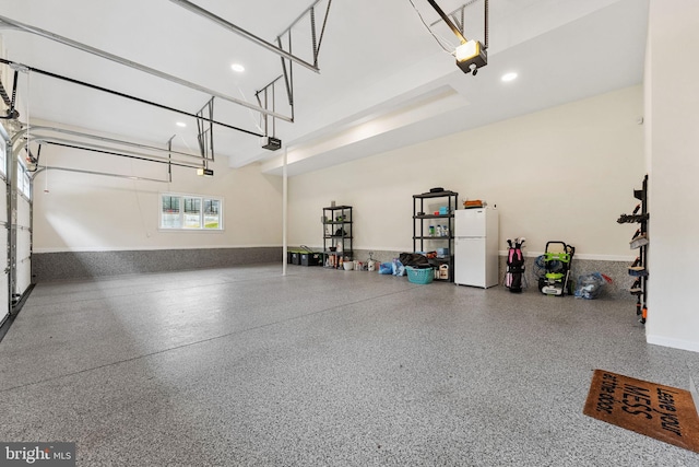 415 Pyles Mountain Ln, Avondale, PA 19311 - garage with freestanding refrigerator, a garage door opener, and recessed lighting