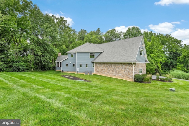 415 Pyles Mountain Ln, Avondale, PA 19311 - view of property exterior featuring a chimney, a yard, stone siding, and roof with shingles