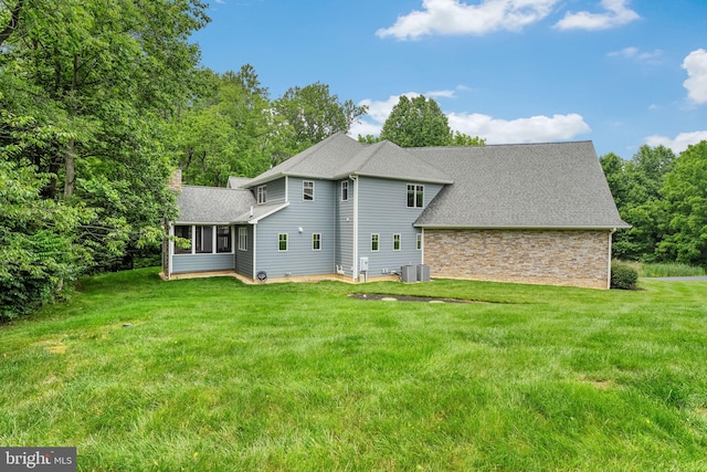 415 Pyles Mountain Ln, Avondale, PA 19311 - rear view of house with a lawn, roof with shingles, a chimney, and stone siding