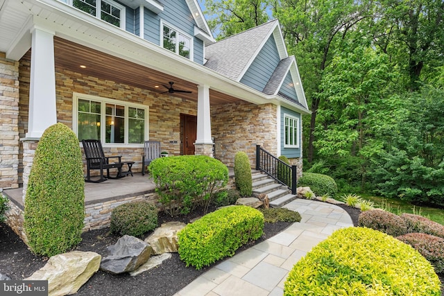 415 Pyles Mountain Ln, Avondale, PA 19311 - property entrance featuring a porch, ceiling fan, a shingled roof, and stone siding