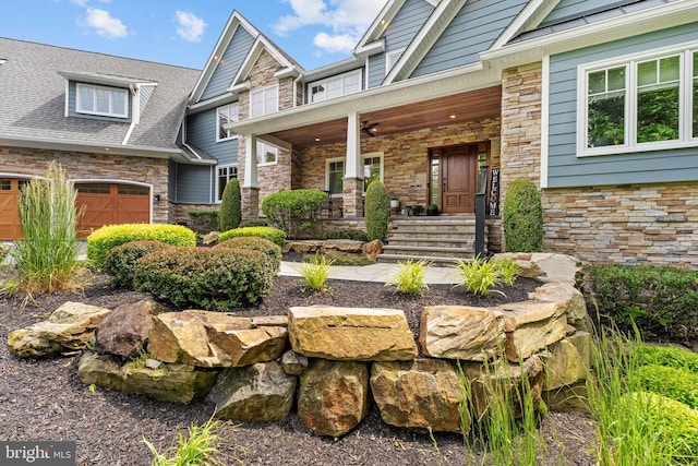 415 Pyles Mountain Ln, Avondale, PA 19311 - doorway to property featuring stone siding, a porch, and an attached garage