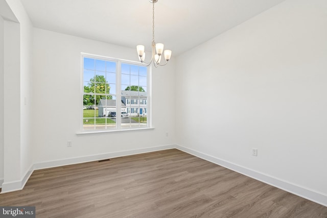 87 Eagle Ln Unit 5, Hanover, PA 17331 - unfurnished room featuring wood finished floors and a chandelier