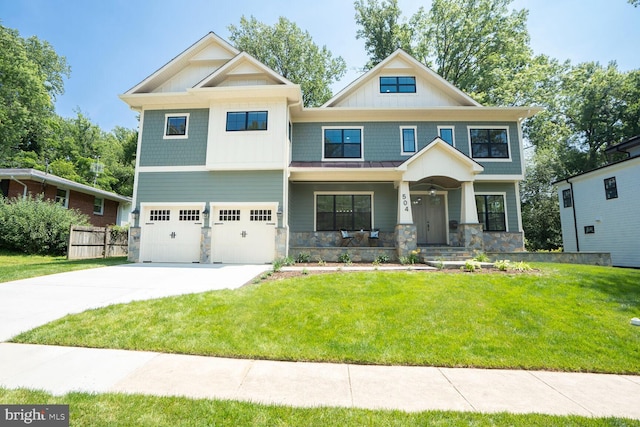 504 Kingsley Rd SW, Vienna, VA 22180 - view of front of property featuring concrete driveway, a porch, stone siding, and a garage