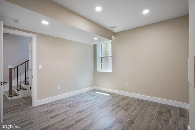 504 Kingsley Rd SW, Vienna, VA 22180 - empty room featuring wood finished floors, stairs, a smoke detector, and recessed lighting