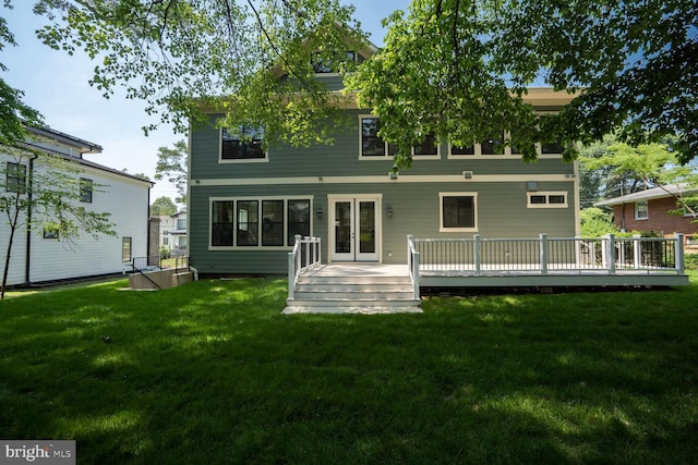 504 Kingsley Rd SW, Vienna, VA 22180 - rear view of house with a wooden deck and a lawn