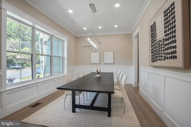 504 Kingsley Rd SW, Vienna, VA 22180 - dining room with crown molding, a decorative wall, dark wood-style flooring, recessed lighting, and wainscoting