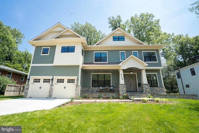 504 Kingsley Rd SW, Vienna, VA 22180 - craftsman-style house with stone siding, covered porch, driveway, an attached garage, and board and batten siding