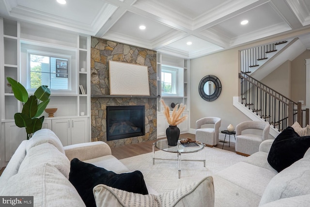 504 Kingsley Rd SW, Vienna, VA 22180 - living area with wood finished floors, stairway, ornamental molding, coffered ceiling, and a stone fireplace