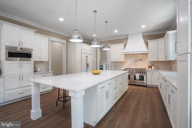 504 Kingsley Rd SW, Vienna, VA 22180 - kitchen with double oven range, premium range hood, a kitchen island, white cabinetry, and ornamental molding