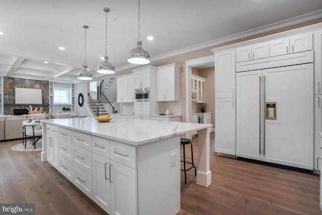 504 Kingsley Rd SW, Vienna, VA 22180 - kitchen with paneled refrigerator, recessed lighting, dark wood finished floors, crown molding, and white cabinets