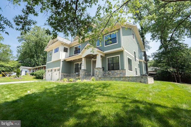 504 Kingsley Rd SW, Vienna, VA 22180 - view of front of property with stone siding, a garage, a porch, and a front yard