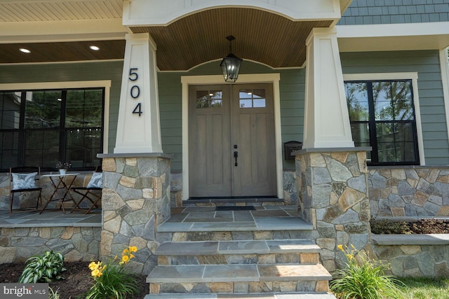 504 Kingsley Rd SW, Vienna, VA 22180 - property entrance with stone siding and covered porch
