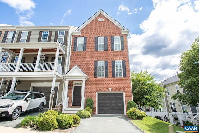 2105 Avinity Loop, Charlottesville, VA 22902 - multi unit property featuring an attached garage, brick siding, driveway, and a balcony