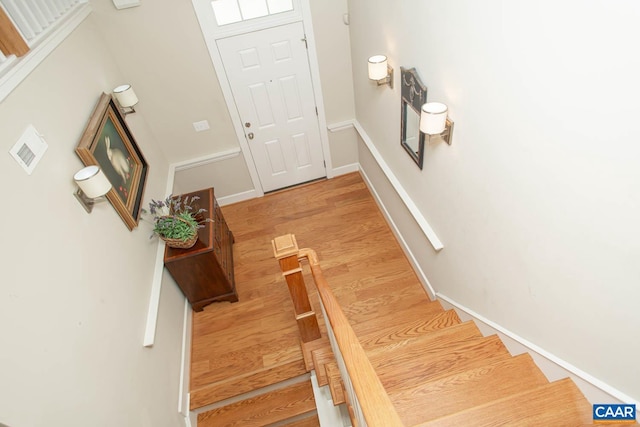 2105 Avinity Loop, Charlottesville, VA 22902 - entrance foyer with light wood finished floors, stairway, and baseboards