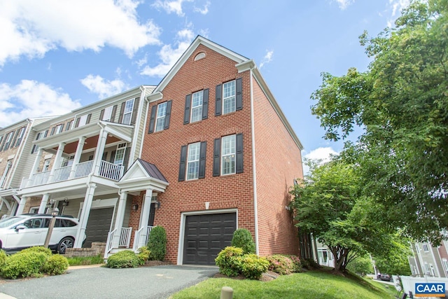 2105 Avinity Loop, Charlottesville, VA 22902 - view of property with an attached garage, brick siding, and driveway
