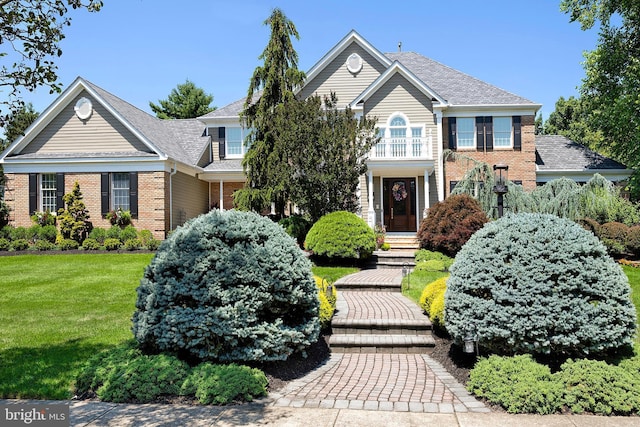 103 Marian Dr, Princeton Junction, NJ 08550 - georgian-style home featuring brick siding, a front yard, and a balcony