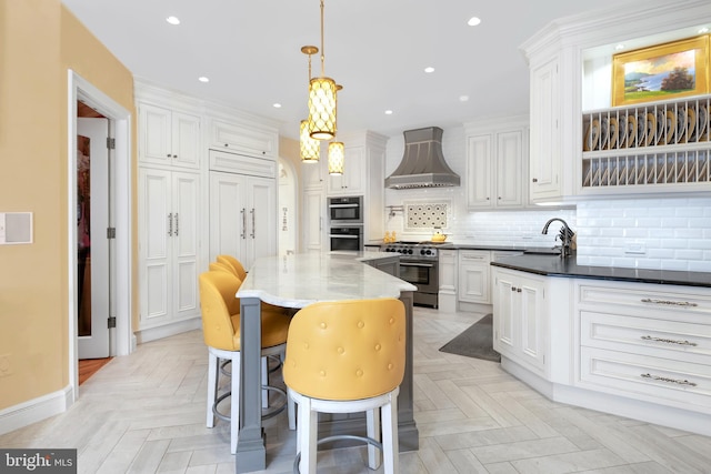 103 Marian Dr, Princeton Junction, NJ 08550 - kitchen with wall chimney exhaust hood, high end stove, white cabinetry, backsplash, and recessed lighting