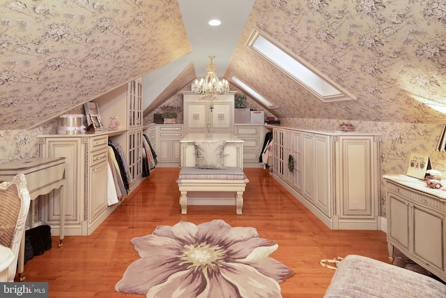 103 Marian Dr, Princeton Junction, NJ 08550 - sitting room featuring a skylight, light wood-type flooring, lofted ceiling, a chandelier, and recessed lighting