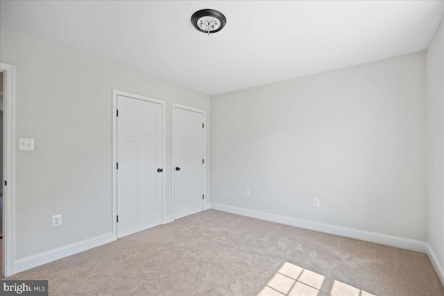 7016 Grace Landing Ct, Hughesville, MD 20637 - unfurnished bedroom with carpet, a closet, and baseboards