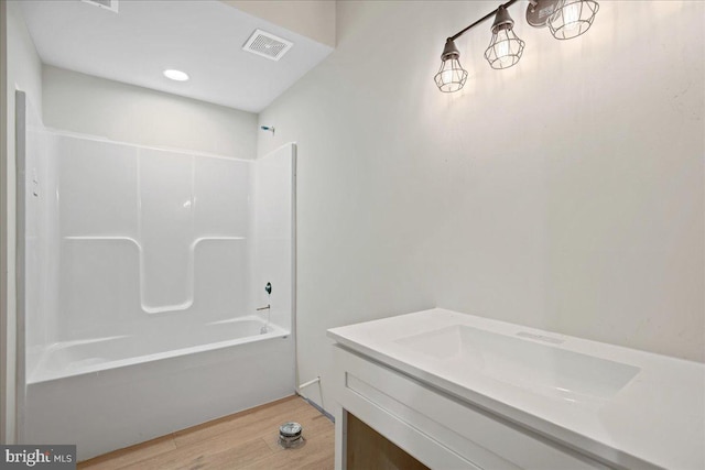 7016 Grace Landing Ct, Hughesville, MD 20637 - full bathroom featuring wood finished floors, shower / bath combination, and vanity