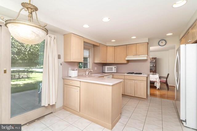 2301 Yellowstone Rd, Cinnaminson, NJ 08077 - kitchen featuring white appliances, light brown cabinetry, under cabinet range hood, healthy amount of natural light, and recessed lighting