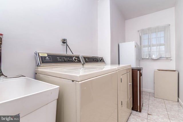 2301 Yellowstone Rd, Cinnaminson, NJ 08077 - washroom with washer and clothes dryer and light tile patterned floors