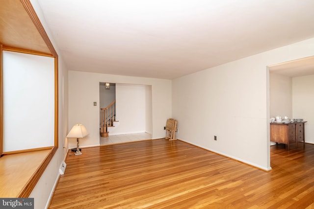 2301 Yellowstone Rd, Cinnaminson, NJ 08077 - empty room with stairway and wood finished floors