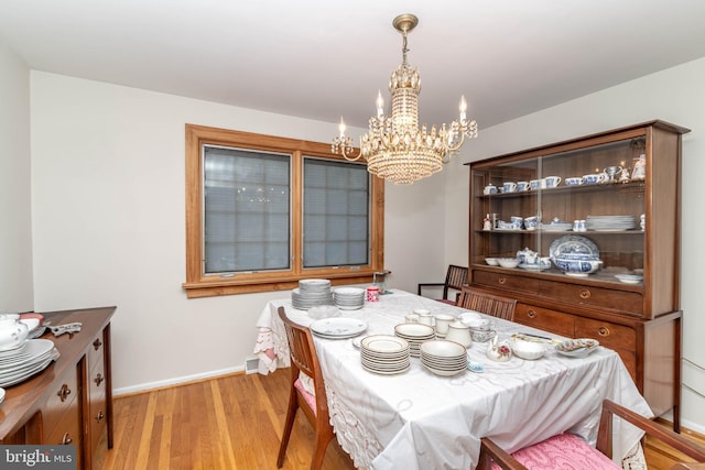 2301 Yellowstone Rd, Cinnaminson, NJ 08077 - dining space featuring a chandelier and light wood-style flooring