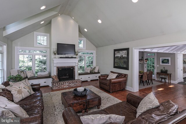 200 Hun Rd, Princeton, NJ 08540 - living area with high vaulted ceiling, wood finished floors, a fireplace, plenty of natural light, and recessed lighting