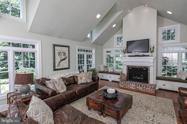 200 Hun Rd, Princeton, NJ 08540 - living area with wood finished floors, high vaulted ceiling, a brick fireplace, plenty of natural light, and recessed lighting
