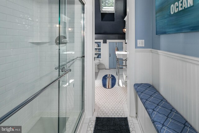 200 Hun Rd, Princeton, NJ 08540 - bathroom featuring toilet, a shower stall, tile patterned floors, and a wainscoted wall
