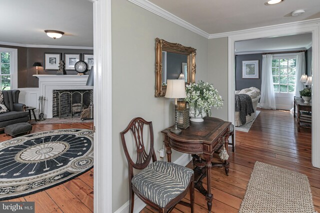 200 Hun Rd, Princeton, NJ 08540 - living room featuring hardwood / wood-style floors, plenty of natural light, crown molding, and a brick fireplace